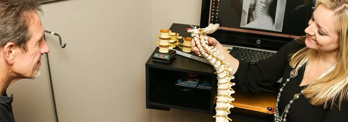 Chiropractor Andover MN Karrie Lehn Showing Patient Spine